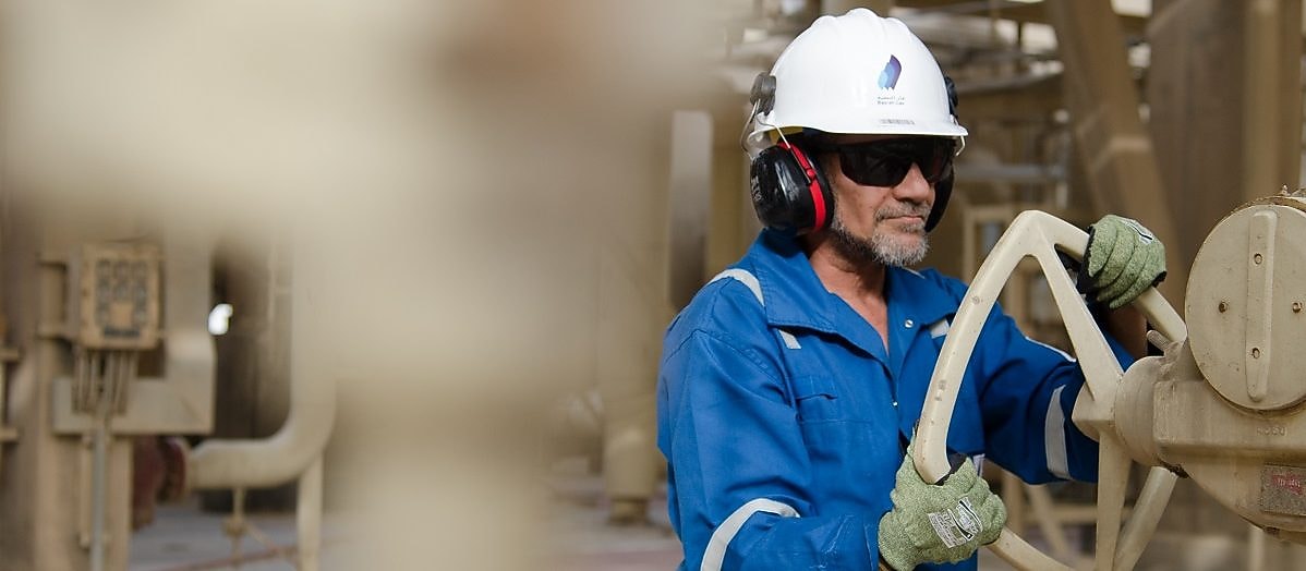 Two men looking at construction of a platform