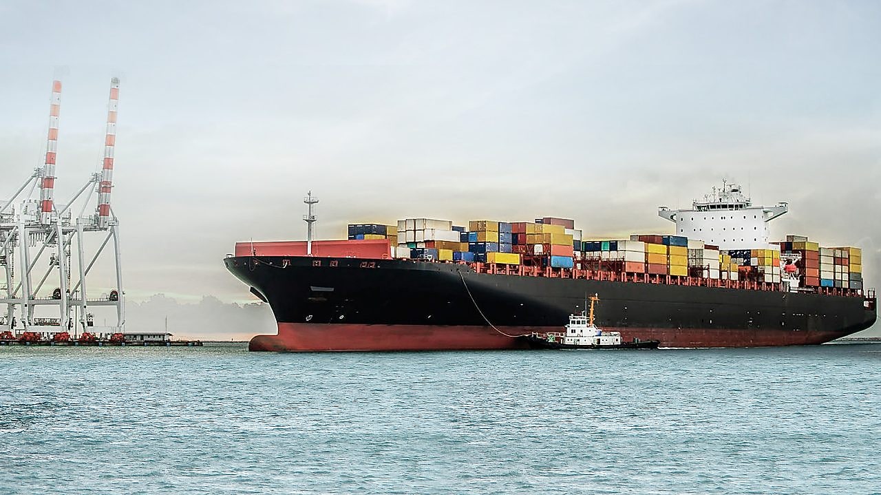 large tanker at sea loaded with container crates