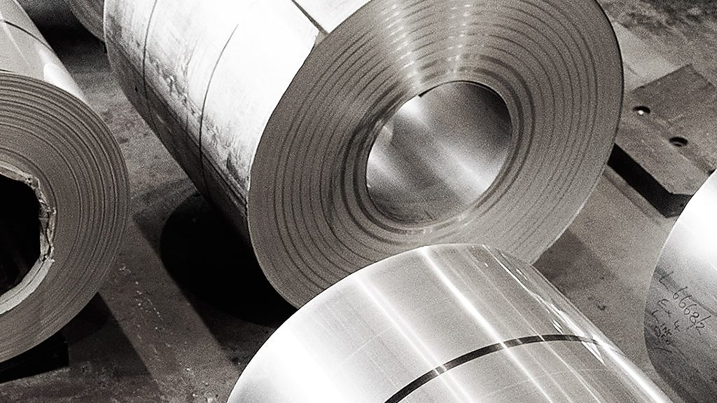 two workers in a metal factory