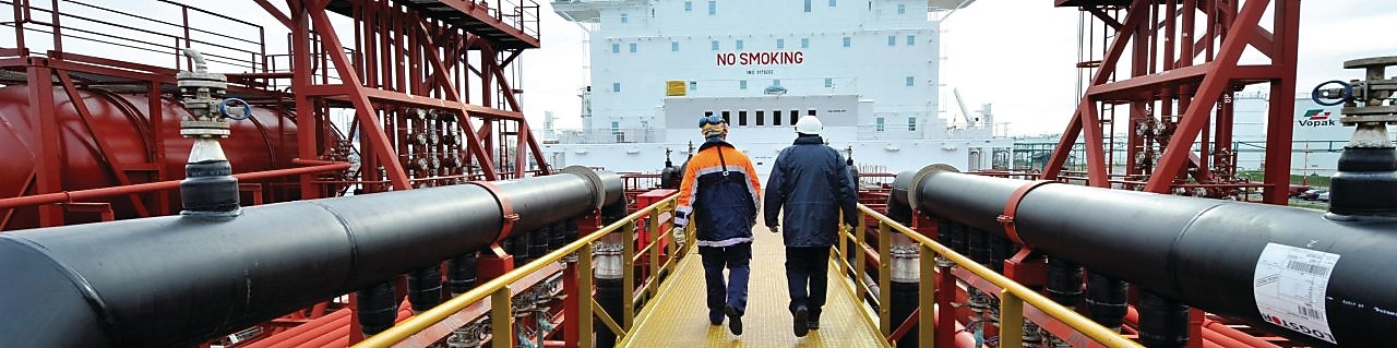 Shell employee walking along on a tanker