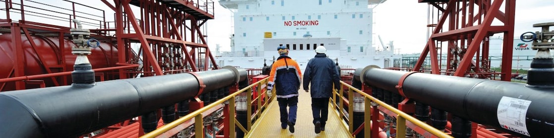 Shell employee walking along on a tanker