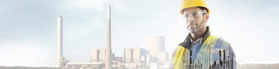 worker in a yellow hard hat transposed onto a background of a power plant
