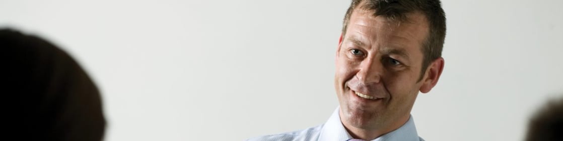 Man presenting at a meeting